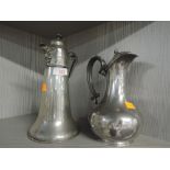 Two vintage pewter wares including claret jug with Norse and Celtic designs