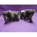 A pair of vintage African carved wood elephants