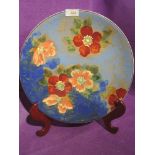 A vintage hand decorated ceramic charger plate by Royal Doulton