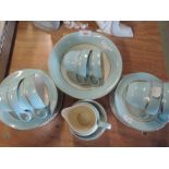 A selection of vintage tea cups and saucers in baby blue