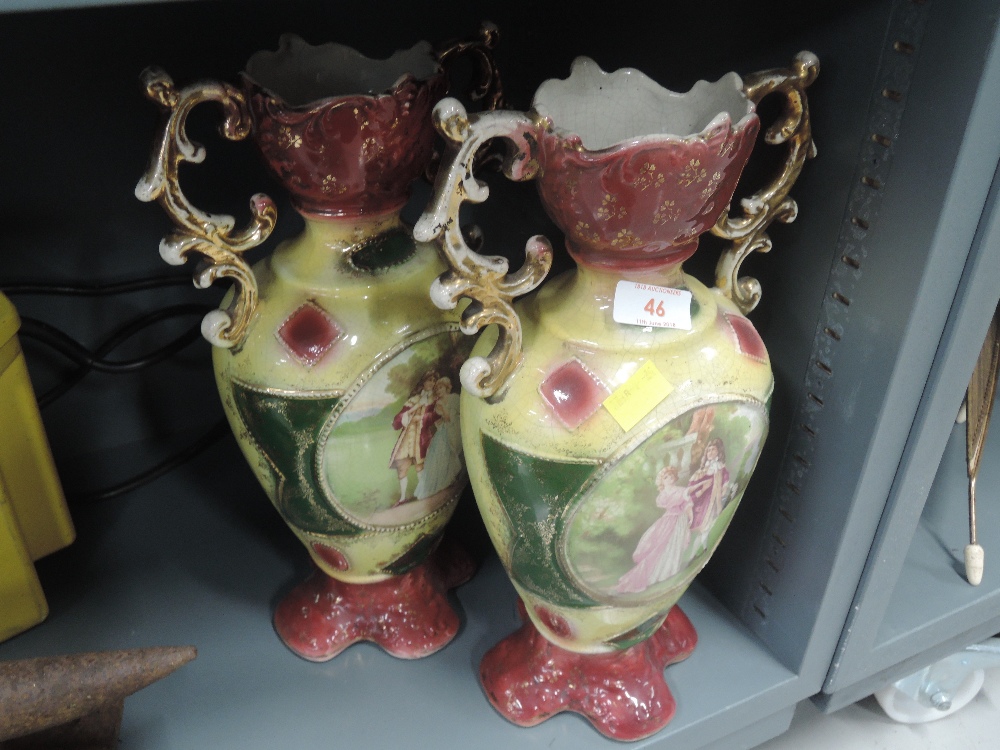 A pair of vintage mantle vases with transfer print