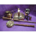 A selection of vintage copper wares including barge kettle and carriage horn