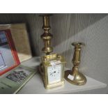 Two brass candle sticks and a vintage carriage style clock