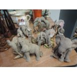 A selection of vintage figures and figurines of playful elephants