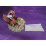 A vintage figurine of Enchantica red dragon