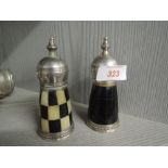 A vintage cruet set in the style of chess pieces