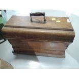 A vintage sewing machine in carry case