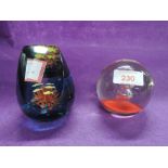 Two modern paper weights with inner designs