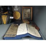 A selection of curios and trinkets including miniature water colour and Lake district map