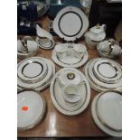 A part dinner service by Royal Dolton in the Harlow pattern