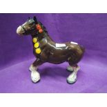 A vintage ceramic figure of shire horse