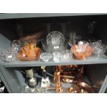 A selection of vintage glass wares including orange carnival and frosted pink
