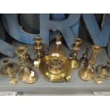 A selection of vintage brass cast candle and chamber sticks