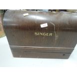 A vintage sewing machine and carry case