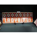 A vintage shop advert advertising sign for Ladybirds books