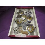 A selection of vintage AA car and hood badges including commercial new old stock and motorcycle