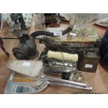 A selection of vintage curios and trinkets including cast ploughman door stop