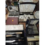 A selection of vintage boxed flatware cutlery and table items