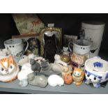 A selection of vintage cat themed figures and trinkets