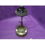 A vintage brass cooking stove or gas burner