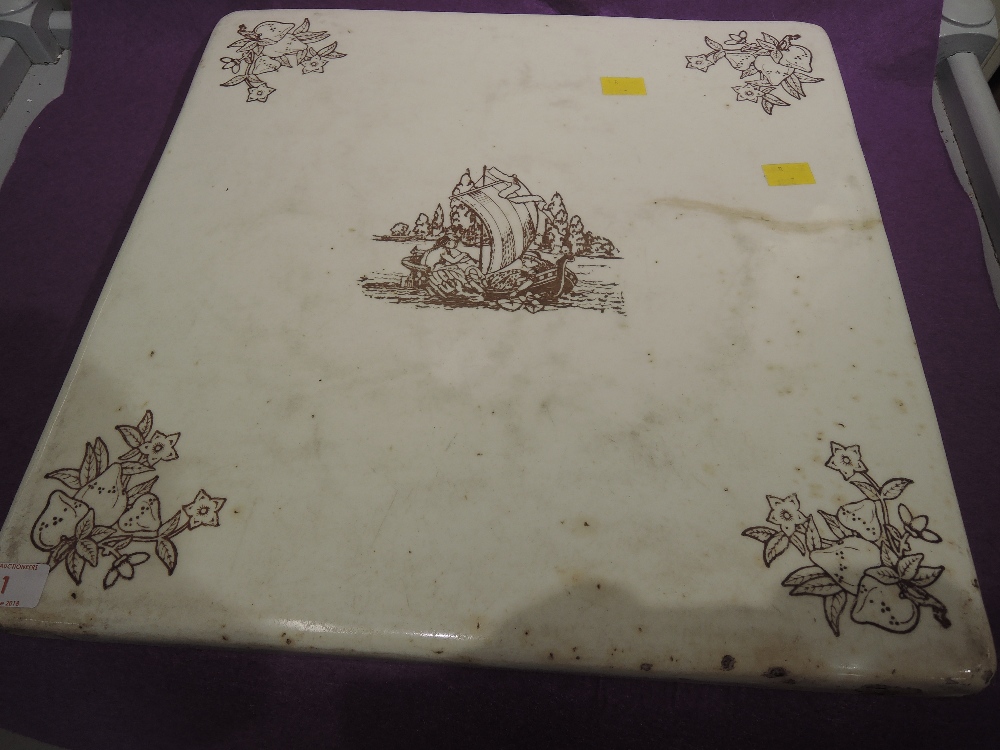 A vintage ceramic chopping board with transfer print an enamel finish