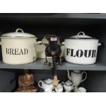 A selection of vintage kitchen items including enamel flour and bread bins