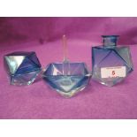 An Art Deco dressing table set in faded blue and clear glass with geometric design