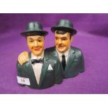 A vintage ceramic figure bust of Stan Laurel and Oliver Hardy