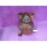 A vintage hand carved wooden pig figure