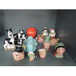 A selection of vintage salt and pepper cruet sets in various forms including Royal Doulton