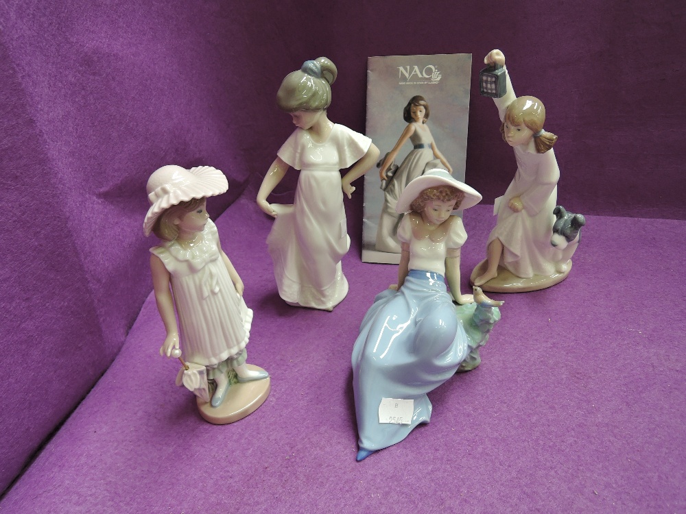 Four Nao figurines, girl with umbrella, girl reclining, girl dancing and girl with dog and light