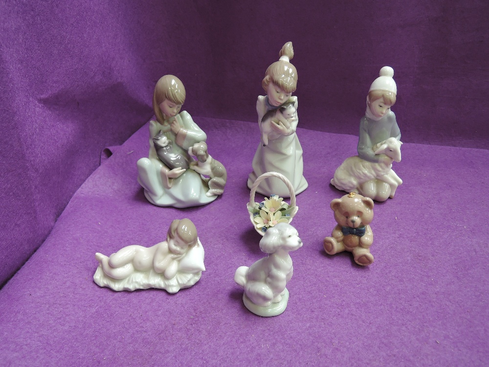 Seven Lladro figurines, animals and flower basket, including 5640, 5712, 4676