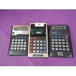 A selection of vintage calculators Sharp and Commodore