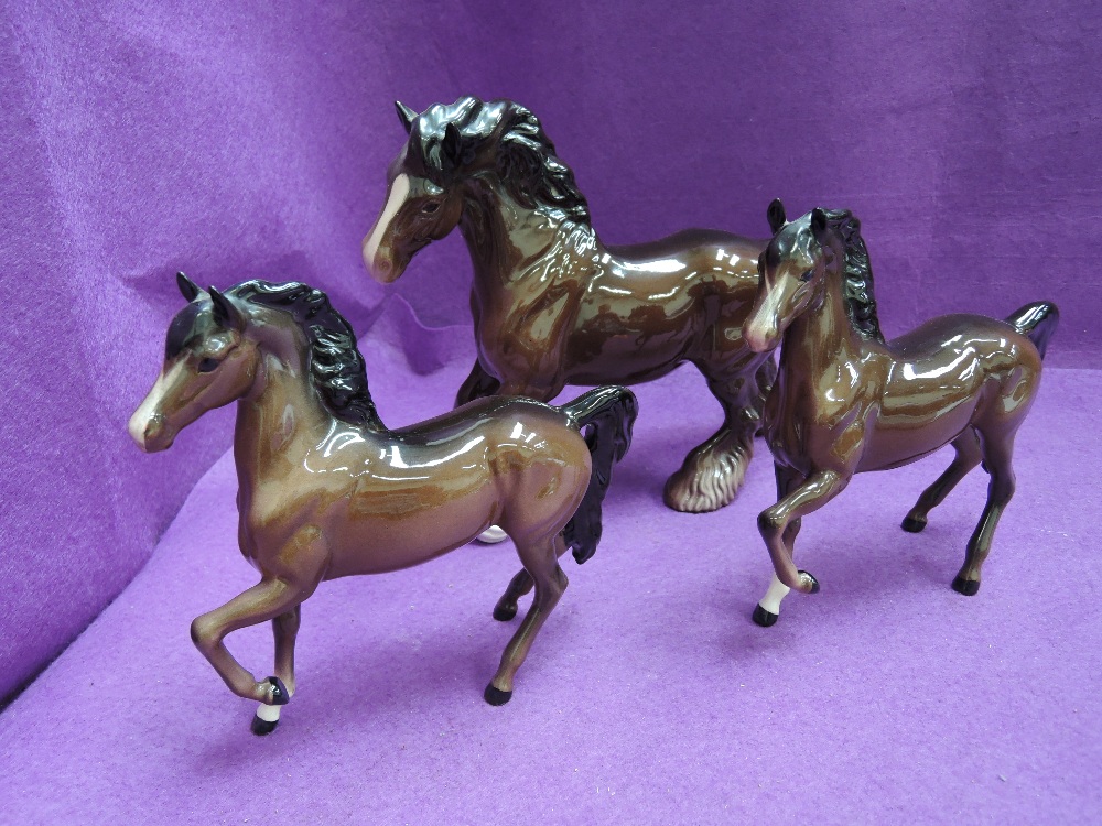 Three Beswick studies, Cantering Shire 975 & Palomino Prancing Arab Type 1261 x2 all brown