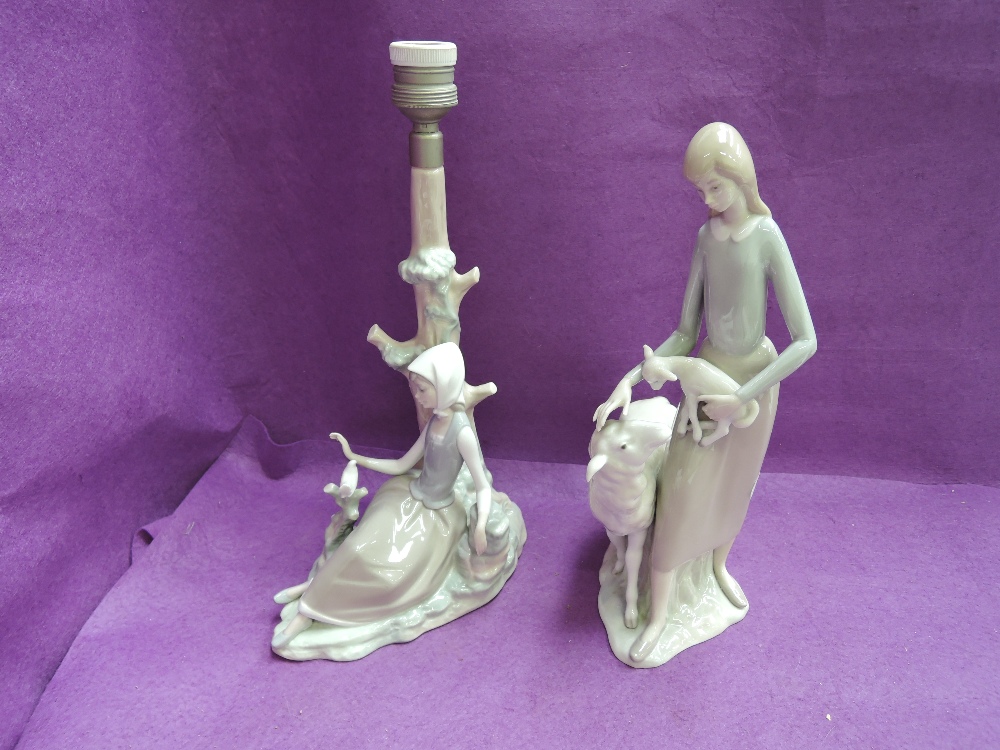 A Lladro table lamp, Girl with Dove and a similar figure group, Girl with Sheep and Lamb