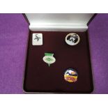 A small Butlin's Loyalty Club case containing four Butlin's badges