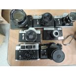 Five Zenit, an Abu O3D-4 and an Omo camera, a Zenet TTL, a Zenet E, Two Zenet 3M, a Zenet SLX and an