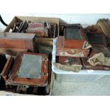 Four boxes of mahogany and brass field camera parts including Thornton Pickard Ruby