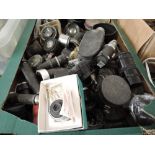 A large box of camera spares, lenses, shutters, filters etc