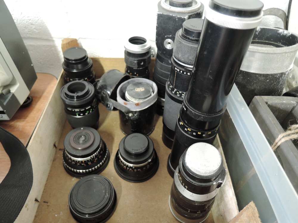 A box of lenses, including a Telyt f=40cm 1:5, a Super Takumar zoom 1:4,5/70-150, a Soligor f=