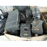 A box of various box cameras, including Ensign, Kodak Brownies etc