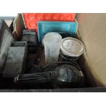 A box of photographic development equipment