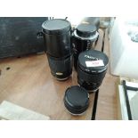 Four lenses for an Olympus OM camera, an Olympus 50mm f=1,8, a Sun Actinon 80-200mm f4,5, a Tamron