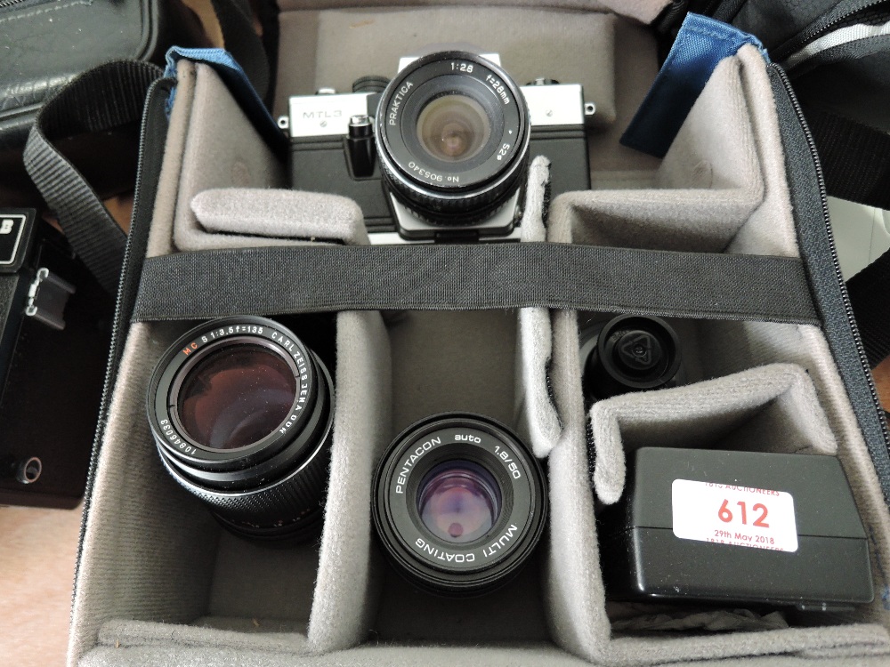 A Praktica MTL3 camera with 1:2,8 f=28mm lens, Carl Zeiss Jena 1:3,5 lens, Pentacon 1,8/50 lens,