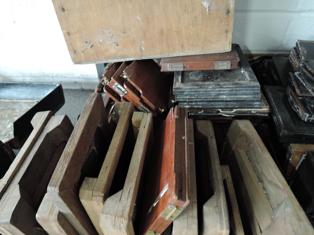 A box of mainly mahogany camera plates