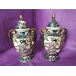 Two vintage lidded urns with hand decorated Satsuma style imagery