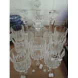 A selection of cut glass wine glasses and decanters