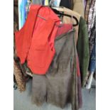 A selection of suede clothing including skirts, waistcoats and jacket