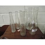 A selection of glass measuring or dosing bottles, Coopers fluke and worm drench
