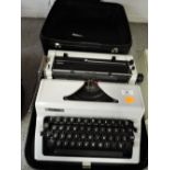 A vintage Erica typewriter in hard carry case